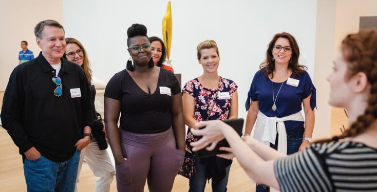 Employees doing team building activities in Atlanta at the museum.